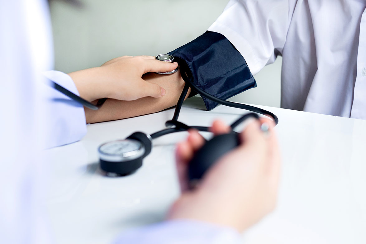 Doctor checking patient. Doctor examines a patient with a stethoscope. Health, Hospital and Medical concept.